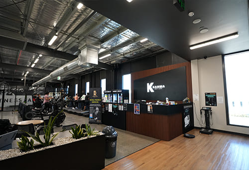 Gym reception area with Kahma 24/7 Gym branding